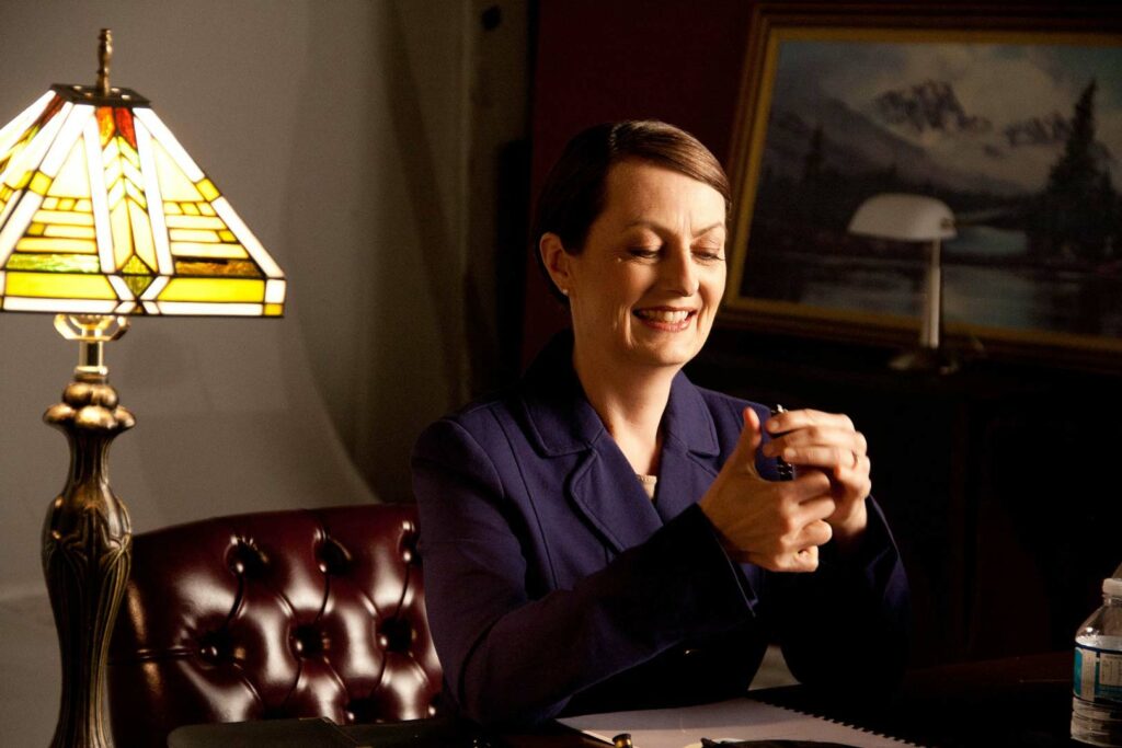 A woman sitting at a desk.